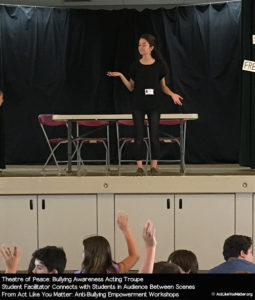 Photo of Theatre of Peace Student Facilitator connecting with students in the audience between scenes. From Act Like You Matter: Anti-Bullying Empowerment Workshops.