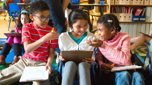 Older students reading the script together and working on the handout