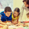 Teacher with Classroom Reading License reading script with older students
